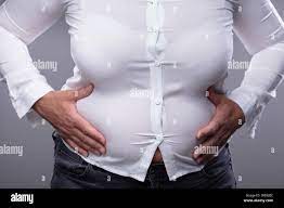 Belly shirt fat woman hi-res stock photography and images - Alamy
