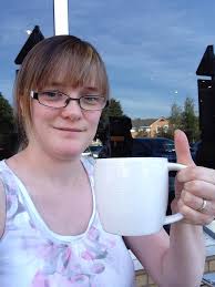 Me and my PSL from Starbucks in Cardiff, Wales :) I didn't like it  much...must be all the chemicals and such.