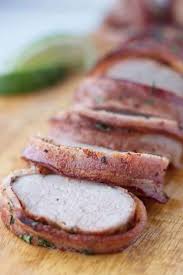 It means baked inside a foil pouch or and just like that our pork tenderloin is dressed for the oven and ready to be wrapped up in foil. Traeger Bacon Wrapped Pork Tenderloin A License To Grill