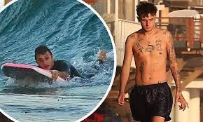 Anwar hadid's new tattoo inspired by artist kyler martz. Anwar Hadid Shows Off His Tattoos As He Enjoys A Solo Beach Day And Body Boarding In Malibu Daily Mail Online