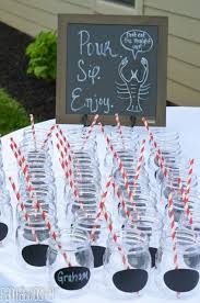 Add lanterns, coconuts, and pineapples to the table for decoration. Crawfish Boil Party Ideas Fantabulosity