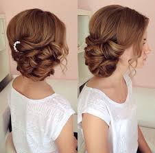 For your next party hairstyle, opt for a side swept chignon to keep your locks off your shoulders. Side Swept Updo Draped Updo Wedding Hairstyles Bridal Hair Ideas Bridesmaid Hair Side Bridal Hair Side Swept Wedding Hair Side