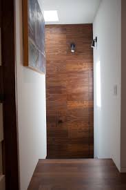 An Abstract Geometric Wall Paneling Incorporating An Invisible Door Soss Hinges Custom Made In Oiled Black Am Door Design Modern Invisible Doors Modern Door