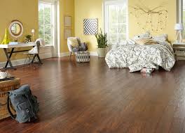 Both laminate flooring and vinyl flooring are usually less expensive than natural hardwood, engineered wood, and many types of ceramic or porcelain tile. Dream Home 12mm Amber Hickory Laminate Flooring Traditional Bedroom Other By Ll Flooring Houzz