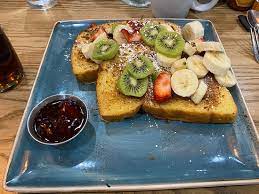 This is not every day eating, . Floridian French Toast Thick Cut Brioche With Wheat Germ And Powdered Cinnamon Sugar Covered With Fresh Banana Kiwi And Seasonal Berries Picture Of First Watch Naples Tripadvisor