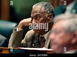 In this March 13, 2013 photo, Colorado State Representative John Buckner,  D-Aurora, listens during a debate period inside the Colorado State  Legislature, in Denver. As a principal at Aurora's Overland High School,
