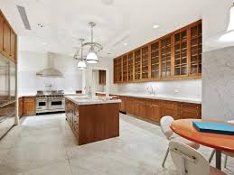 Contemporary open plan kitchen in sydney with white cabinets, marble benchtops, white splashback, engineered quartz splashback photo of a contemporary kitchen in brisbane with light wood cabinets, marble benchtops, marble splashback, concrete floors, a peninsula and grey floor. 15 Kitchens With Beautiful Marble Floors Housely