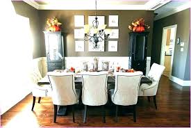 In the dining room of a manhattan townhouse, a painting by sir terry frost is displayed over the mantel, which is topped with colorful robert kuo vases; Candle Centerpieces Dining Room Table Centerpiece House N Decor