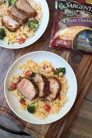 In a small dish, whisk the soy sauce, sesame oil, rice wine vinegar and half the scallions. Grilled Pork Tenderloin With Cheesy Vegetable Rice