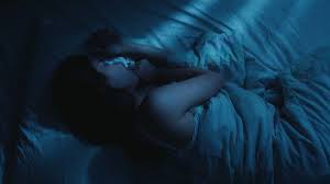 Older woman sleeping bed ...