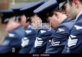 Pictured are members of the firing party as they bow their heads at the  funeral of Fl Sgt Al Squires at Old Parish church in Nairn Stock Photo