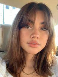 The hair is cut straight across the forehead in a blunt manner. T I F F A N Y In 2021 Aesthetic Hair Hairstyle Short Hair Styles