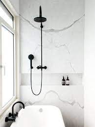 16 Perfect Marble Bathrooms With Black Fixtures Bathroom Trends Bathroom Inspiration Black White Bathrooms
