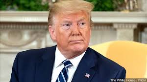 Trump says energy-saving light bulbs are why 'I always look orange'