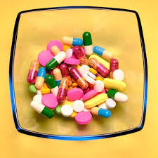 Pharmaceutical Medicine Pills Tablets And Capsules In Bowl On Yellow Background Pharmacy Student Mason Jar Meals Meals In A Jar