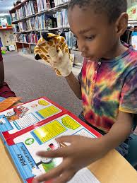 Abby and Ryan are enjoying their Summer reading at the Library and beach!  #WestHaven #WestHavenLibrary #summer #beach #library
