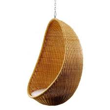 10 Easy Pieces Rattan Hanging Chairs Gardenista Hanging Egg Chair Indoor Chairs Egg Shaped Chair