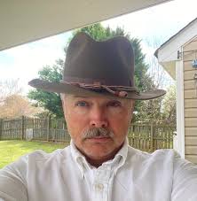 Disapproval and embarrassment at having to wear the Santa hat as a holiday  tradition!