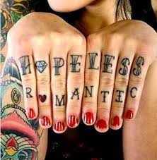 I also knew i wanted to get a hopeless romantic tattoo on me somewhere, because that is pretty much me in a nutshell. Hopeless Romantic Tattoos Inked Magazine Romantic Tattoo Knuckle Tattoos Finger Tattoos