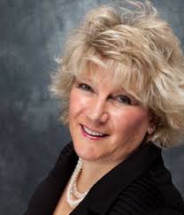 MAUREEN E. SMITH, PRESIDENT/CEO