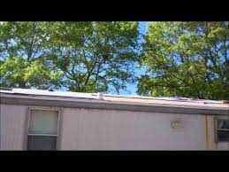 The best way to handle roof rumble is to stop the wind from getting under that metal. Mobile Home Trailer Roof Rusted Tin Roof Youtube