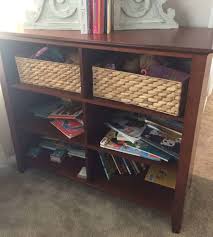 I took some left over beadboard, painted it blue, cut it to size with a jig saw, and placed it in the back of the hutch. How To Refurbish A Faux Wood Bookcase With Chalk Spray Paint