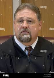Marinette County Circuit Court Judge David Miron resides over the initial  court appearance of James Nichols Tuesday, Jan. 16, 2007, in Marinette,  Wis. Nichols was charged Tuesday with murdering Cha Vang, 30,