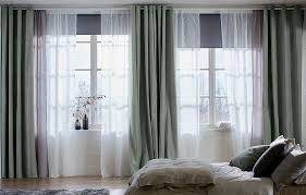 A Bright Bedroom Featuring Mullion Windows With Black Block Out Roller Blinds One Layer Of Sheer White Curtains Curtains Living Room Stylish Bedroom Curtains