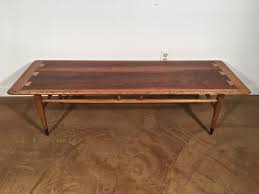This sturdy walnut coffee table from lane furniture's perception line features uniquely styled legs and a basket. Mid Century Modern Walnut Coffee Table By Lane Acclaim C 1966 Epoch