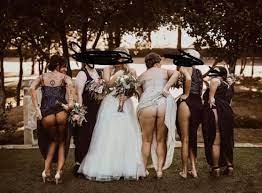 Trashy' bridesmaids shamed for flashing their BUMS in bizarre wedding photo  – The Irish Sun | The Irish Sun