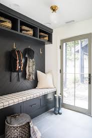 Designing a mudroom that is organized, attractive and durable requires a realistic assessment of your needs, habits and. Black Mudroom Bench With Black Chevron Pattern Backsplash Cottage Laundry Room
