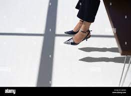 Dangling shoe woman hi-res stock photography and images - Alamy