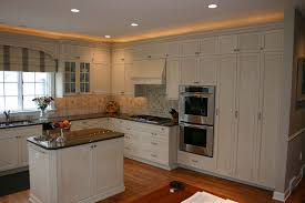 A new larger window floods the kitchen in natural light. Custom Kitchen Cabinets