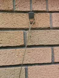 Devices called brick clips or brick hangers allow people to hang pictures, mirrors and other objects on walls without drilling into the brick. 4 Tested Ways To Hang Things On A Brick Wall No Drill Besidethefrontdoor Com