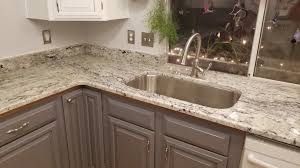 White ice granite is durable enough for use in commercial installations as well as residential ones, and uniquely used as a door. White Ice Granite Countertops Traditional Kitchen Seattle By Tops Solid Surface