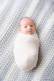 baby on grandmom s blanket wide away newborn baby boy swaddled baby session newborn baby newbornpho photographing babies new baby products baby swaddle