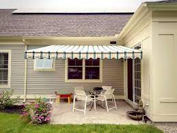 This Nuimage Awnings Pro Series 7700 Retractable Patio Awning Is Shown With A Scalloped Valance And Sunbrella Strip Awning Retractable Awning Sunbrella Awnings
