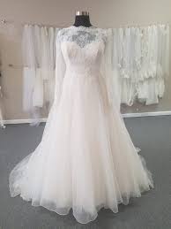 Delicate lace is placed throughout the skirt, adding dimension and distinct drama to this plus size gown. Plus Size Wedding Dresses For Less Garnet Grace Discount Designer Wedding Dresses