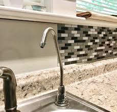 I buy mine premixed) to the back of the tile with the trowel. Diy Peel And Stick Backsplash Review Steps The Frugal South