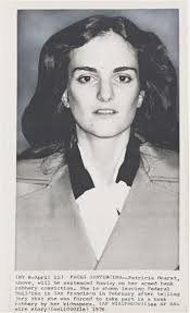 SLA PATTY HEARST) Two press photographs of Patty Hearst on