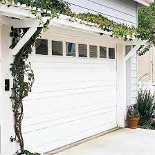 It's a structure designed to allow climbing plants to grow over your garage door. 16 Attached Pergola Ideas To Boost Shade And Style Door Pergola Pergola Pergola Designs