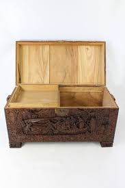 Base notes are agarwood (oud), patchouli and leatherwood. Carved Chinese Camphor Wood Chest Coffee Table