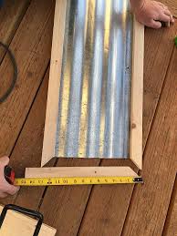 Lay down the corrugated sheet metal on a worktable or any flat area. Corrugated Metal Home Sign Project By Decoart