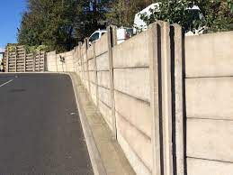 One of our fence posts is attached to a concrete wall. Concrete Fence Panels Ardcroney