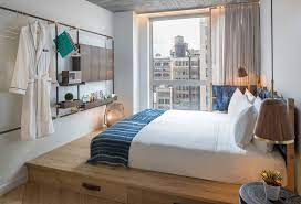The Made Hotel In New York Includes Warm Wood Elements Throughout Its Design Small Hotel Room Modern Hotel Room Hotel Room Design