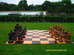 Giant Chess Table For My Guests On The Lawn Or Maybe Just Small Mismatched Chess Sets From Indoors Placed Outside Under T Giant Chess Chess Board Backyard