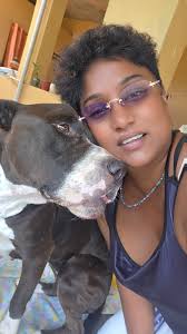 In the yard playing with my friends pitbull. Had to get a shot of that  mouth. 😆