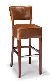In upholstery, leather is the end of the conversation for anyone who enjoys a custom, comfortable seat. Genova Bar Stool Tan Aniline Leather Walnut