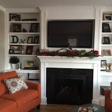 This huntington tv lift cabinet features a warm and cosy fireplace, which will emit gorgeous glow combined with a toasty heater that will help heat even the frostiest days. A Fireplace Surround With Built Ins And Recessed Tv Dan Dewolf Masonry And Contracting