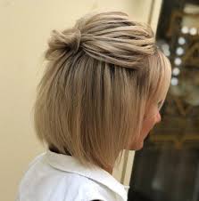 Put a twist on your short hair and wear it in a cute half up half down hairdo. Hairstyle Updo Tutorial Easy Hair Updos Short Hair Styles Easy Short Hair Updo